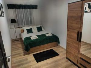 Posteľ alebo postele v izbe v ubytovaní Apartament Berylowa 1