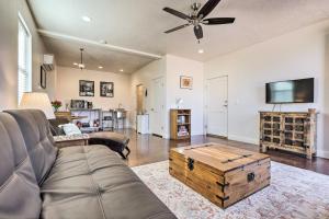 a living room with a couch and a ceiling fan at Aspens Retreat Studio in Kanab with Patio! in Kanab