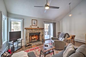 a living room with a couch and a fireplace at Lake Harmony Townhome Less Than 1 Mi to Jack Frost! in Lake Harmony