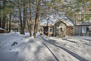 a house in the snow with a tree at Less Than 1 Mi to Jack Frost Lake Harmony Townhome! in Lake Harmony