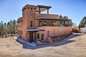 a large house in the middle of a field at Quaint Kanab Casita - 3 Mi to the Heart of Town! in Kanab