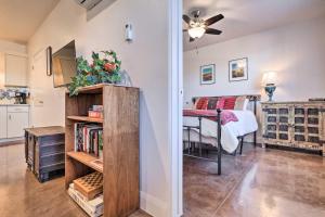 a room with a bed and a room with a book shelf at Quaint Kanab Casita - 3 Mi to the Heart of Town! in Kanab
