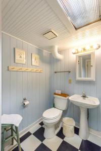 a bathroom with a toilet and a sink at 406 E ARCTIC in Folly Beach +18 photos