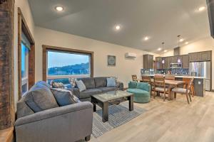 a living room with two couches and a table at Sanderling Sea Cottages, Unit 5 with Ocean Views! in Waldport
