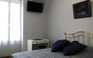 Postel nebo postele na pokoji v ubytování Le Domaine des Gemmes