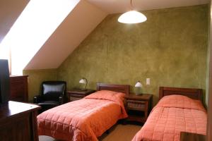 Postel nebo postele na pokoji v ubytování Sarlóspuszta Club Hotel