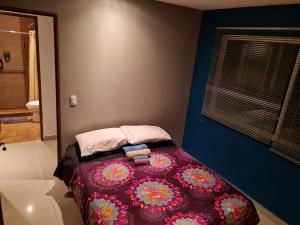 Кровать или кровати в номере Division del Norte Rooms