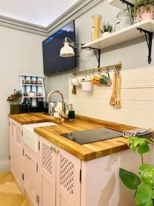 a kitchen with a sink and a counter top at Old Riga Designer Luxury Apartment in Rīga