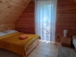 En eller flere senge i et værelse på U Eskulapa Bieszczady