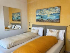 Ένα ή περισσότερα κρεβάτια σε δωμάτιο στο Appartamenti Villa Eden