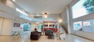 a living room with a couch and chairs and a table at Habitat Prime Hotel in Leme