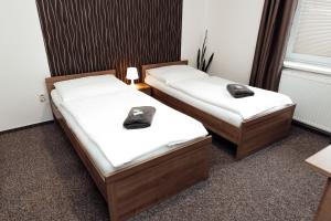 Posteľ alebo postele v izbe v ubytovaní PENZION VERMON