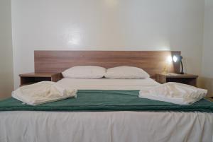 Cama ou camas em um quarto em Be Caju Hotel