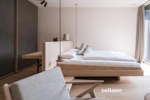 Voodi või voodid majutusasutuse zelloon boutique hotel toas