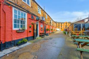 a row of red brick buildings on a city street at The Watergate Inn in York