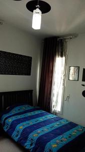 Кровать или кровати в номере Maison koukou