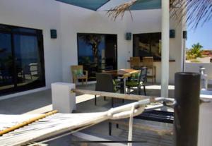 a view of a patio with a table and chairs at Beach Front Lofts, La Ventana in La Ventana
