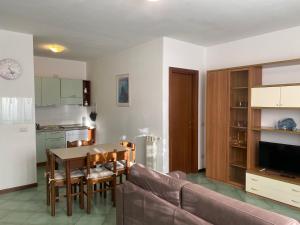 a living room with a couch and a table at Smeraldo in Levanto +6 photos