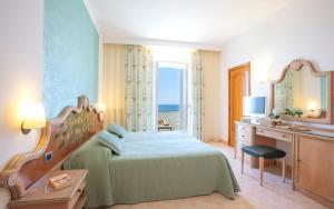 Postel nebo postele na pokoji v ubytování Hotel Parco Smeraldo Terme