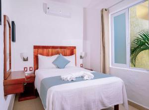 Postel nebo postele na pokoji v ubytování Villas & Resort Luz de Luna
