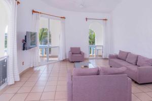 TV a/nebo společenská místnost v ubytování Villas & Resort Luz de Luna