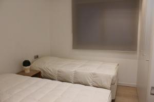 En eller flere senger på et rom på LovelyLoft San Fernando 8