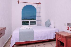 Postel nebo postele na pokoji v ubytování Villas & Resort Luz de Luna