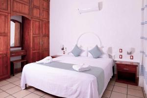 Postel nebo postele na pokoji v ubytování Villas & Resort Luz de Luna