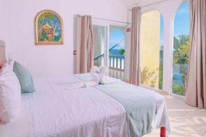 Postel nebo postele na pokoji v ubytování Villas & Resort Luz de Luna