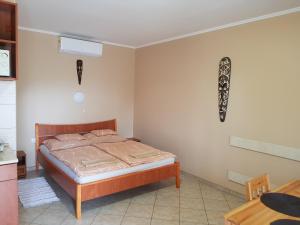 Postel nebo postele na pokoji v ubytování Muskátli Apartman