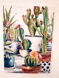 a painting of a group of cactuses in pots at Deluxe Alba in Locorotondo