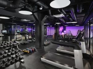 a gym with treadmills and cardio machines at Axiom Hotel in San Francisco