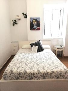 Een bed of bedden in een kamer bij Un Patio al Sur