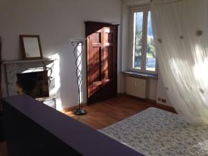 A bed or beds in a room at Casale di Charme Bellaria