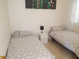 Postel nebo postele na pokoji v ubytování Sunlight Apartment - Molino Blanco - La Zenia