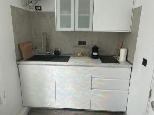 A kitchen or kitchenette at Luxury studio, sea view, pool