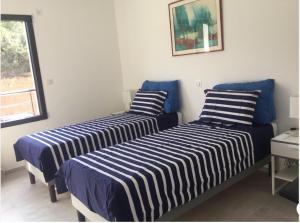 Postel nebo postele na pokoji v ubytování Superbe appartement T3 face mer baie Ajaccio