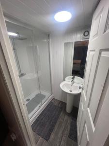 a bathroom with a shower and a sink at The Honley hotel in Blackpool +26 photos