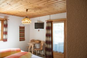 Postel nebo postele na pokoji v ubytování Alpina Hotel-Apartments