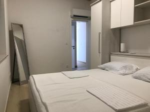 Postel nebo postele na pokoji v ubytování Kozino Apartments