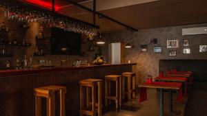 a bar with a row of tables and chairs at Instyle Residences at Infiniti Blu in Sosúa