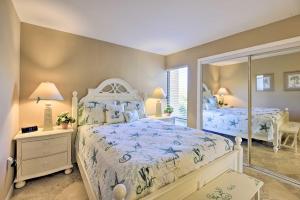 a bedroom with two beds and a mirror at Siesta Key Condo Resort Amenities, Walk to Beach! in Siesta Key +49 photos