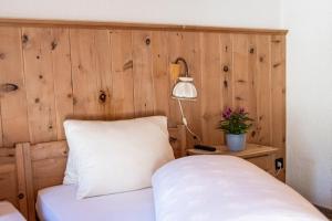 Postel nebo postele na pokoji v ubytování Alpina Hotel-Apartments