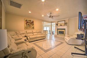 a large living room with a couch and a tv at El Paso Home with BBQ Grill - 4 Mi to Sunland Park! in El Paso