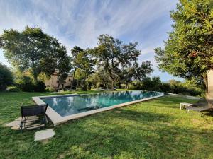 a swimming pool in the yard of a house at Mas Miraflors in Perpignan