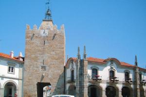a building with a tower with a clock on it at Holiday Home bei Viana do Castelo Carreco - PON03016-F in Carreço