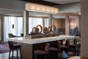 a hotel lobby with a vanity with five mirrors at Sonesta Select Los Angeles LAX El Segundo in El Segundo