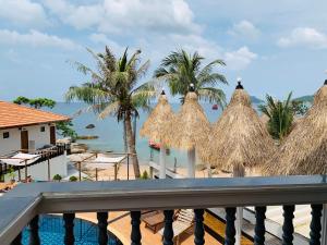 a view of the beach from the balcony of a resort at Koh Tao Heritage in Ko Tao