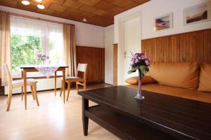 a living room with a couch and a table at Apartment, Sternberg in Sternberg