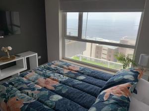 Postel nebo postele na pokoji v ubytování Tantum Concon Apartment